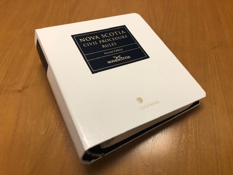 Binder of court rules.