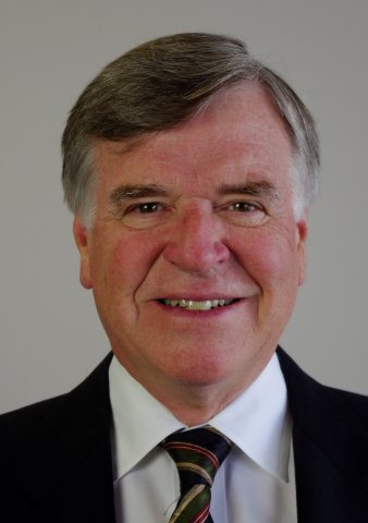 Man wearing a dark suit and tie.