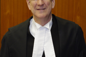Tall white man in judicial robes.